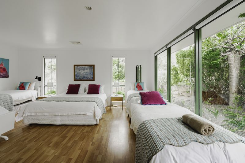 A light-filled bedroom opening onto the garden