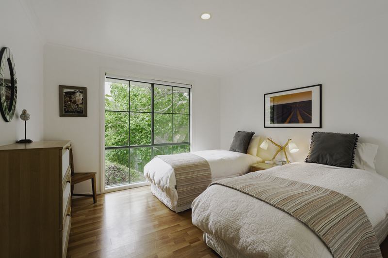 Twin bedroom with garden views